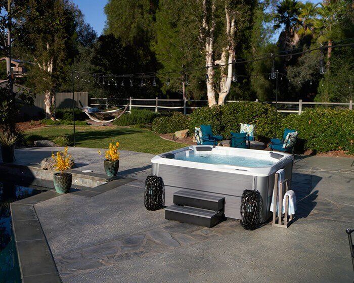 Hot Tub in a paved backyard patio